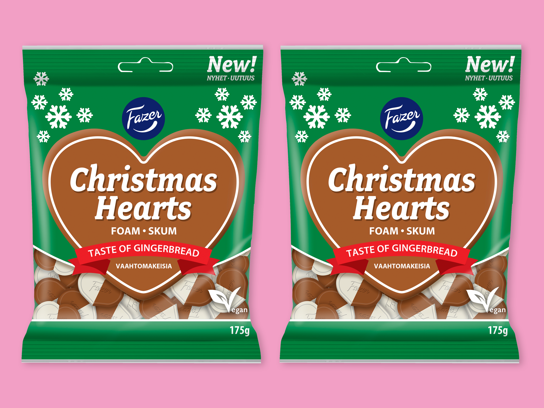 Produktfoto: Fazer Christmas Hearts från Fazer, två påsar bredvid varandra mot rosa bakgrund.