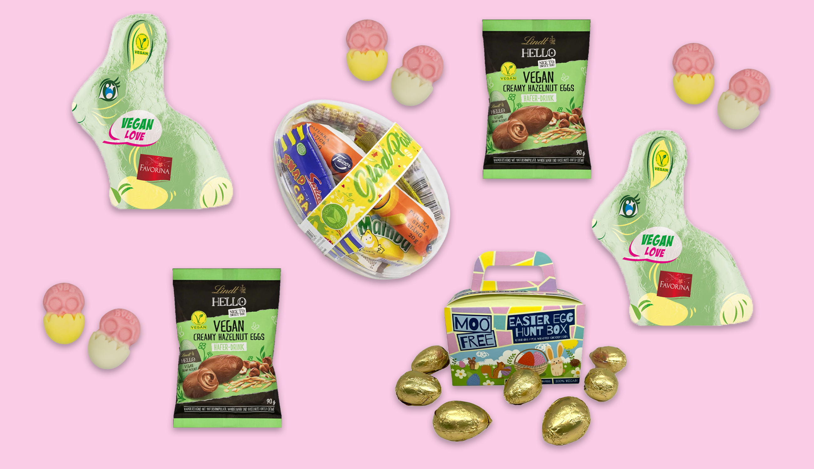 flera veganska påskgodisar utspridda mot en ljusrosa bakgrund