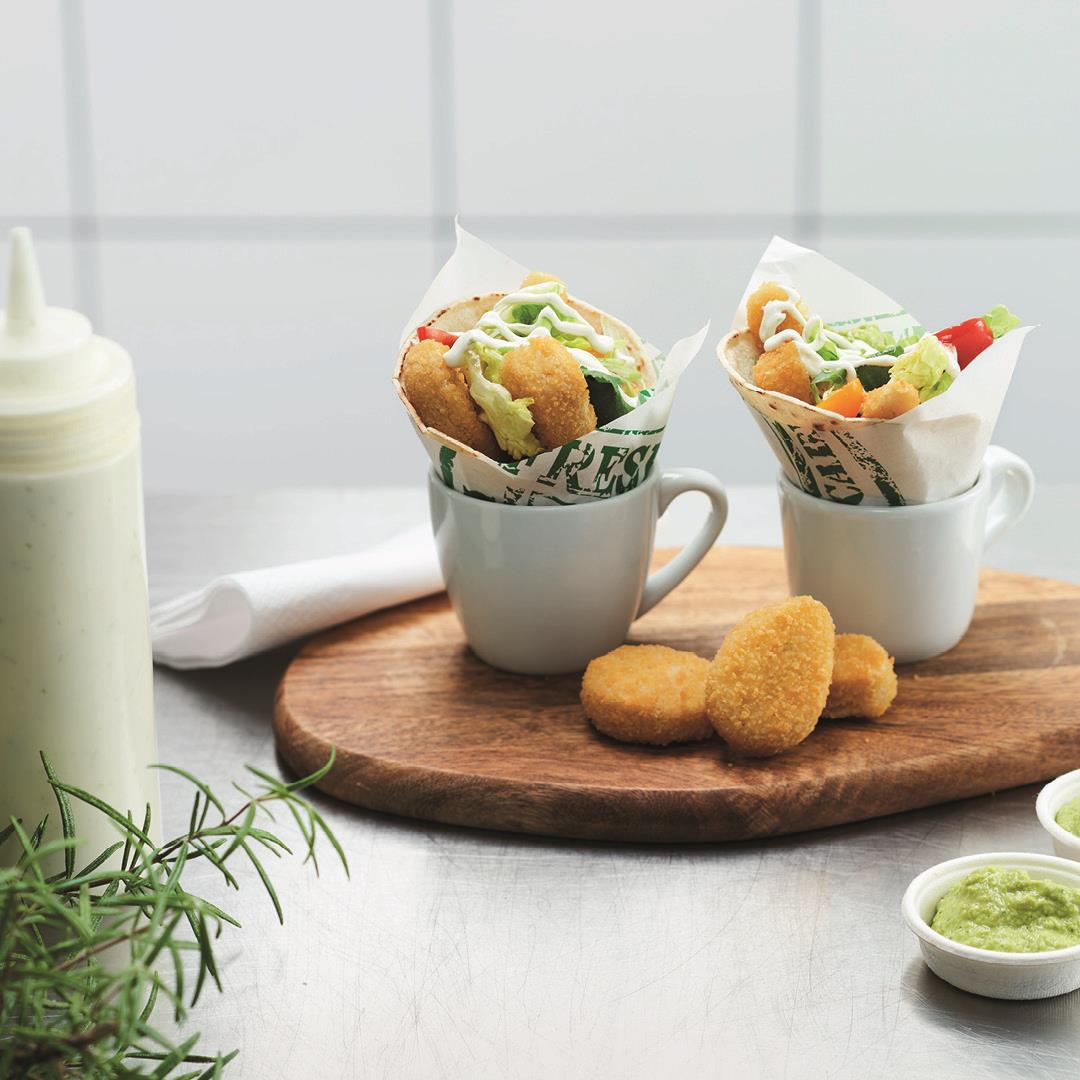 Produktfoto: Orkla Felix frasiga vegonuggets i två koppar med grönsaker och sås