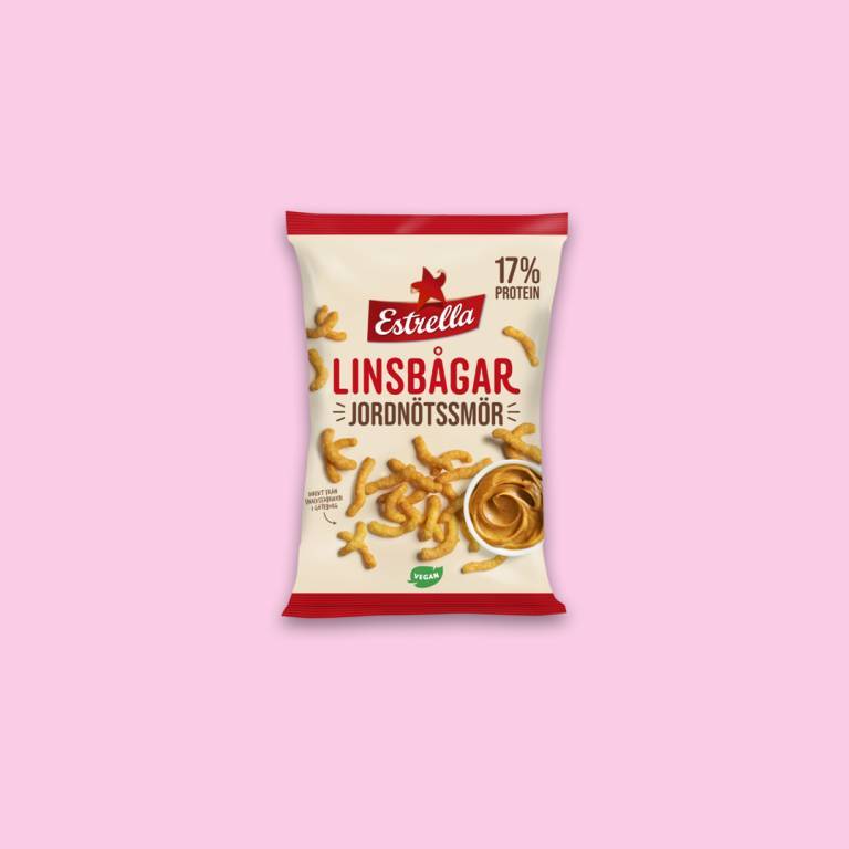 Chipspåse mot en ljusrosa bakgrund. 