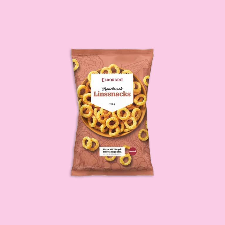en påse chips mot en ljusrosa bakgrund