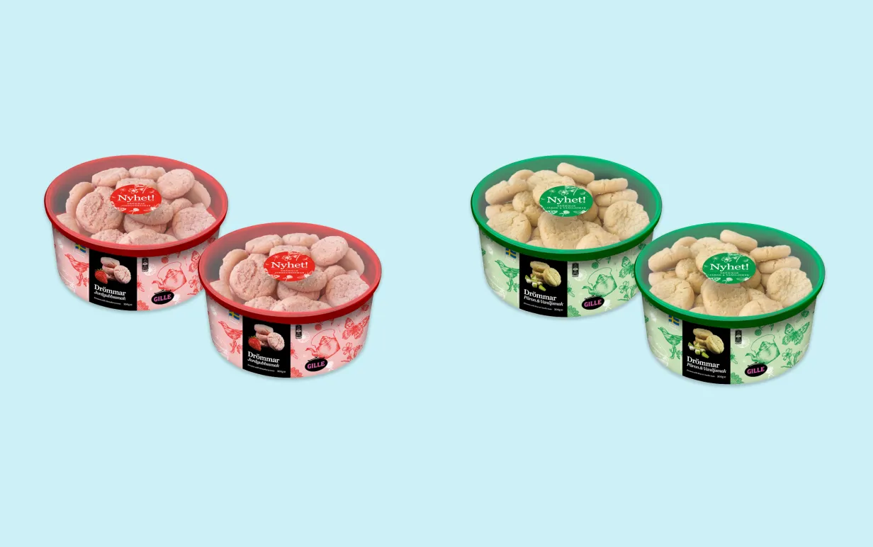 4 burkar med kakor placerade omlott mot en ljusblå bakgrund