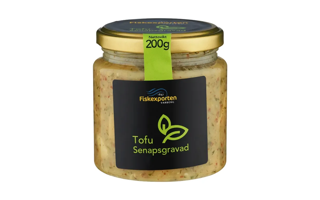 en burk med vegansk sill mot en vit bakgrund