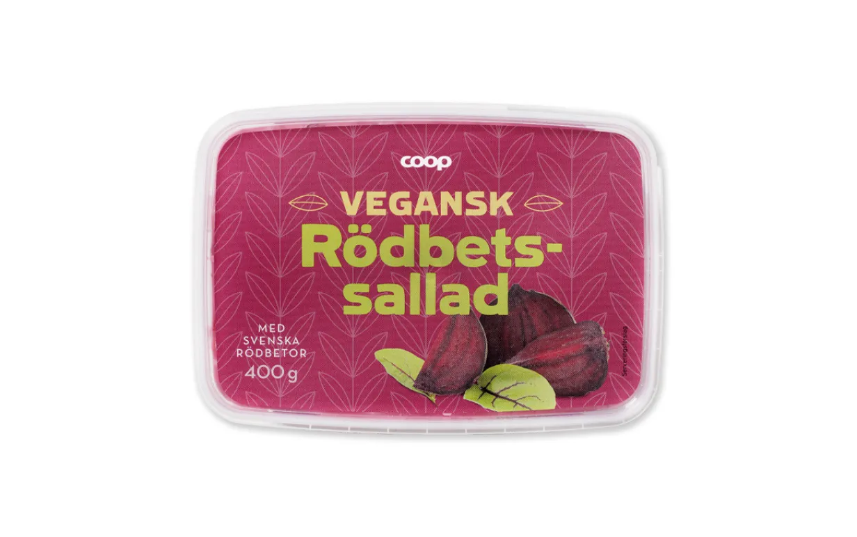 en burk veganska rödbetssallad mot en vit bakgrund