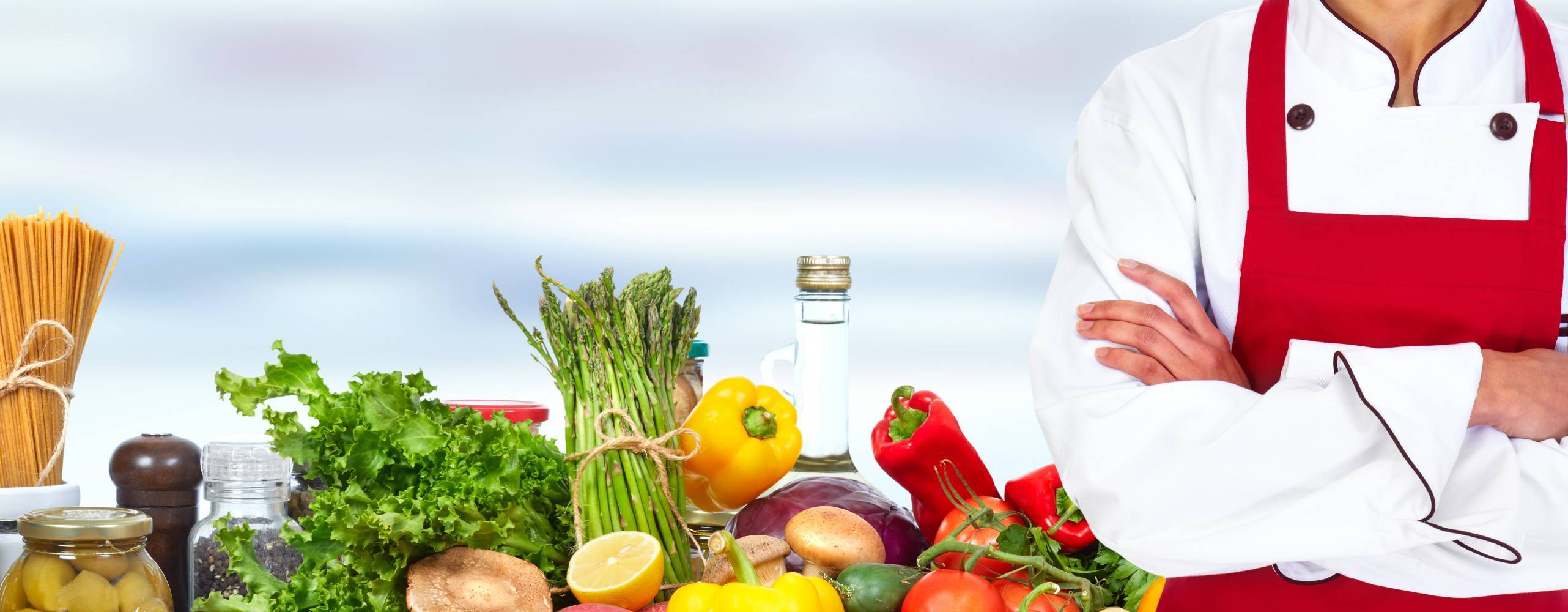 Bild på grönsaker och kock med korsade armar