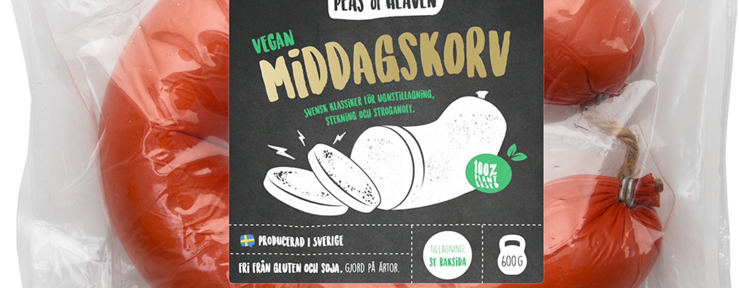 Ring med middagskorv i plastförpackning med Peas of heavens logga på där det står middagskorv i guldiga bokstäver och en bild på en korv i svart och vitt.