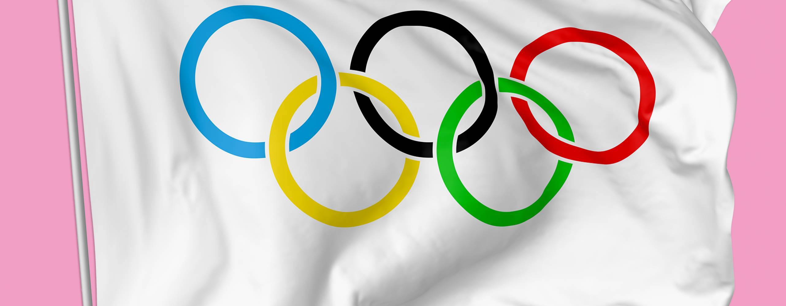 Foto flagga: Alexey V Smirnov/Shutterstock Olympisk flagga mot rosa bakgrund