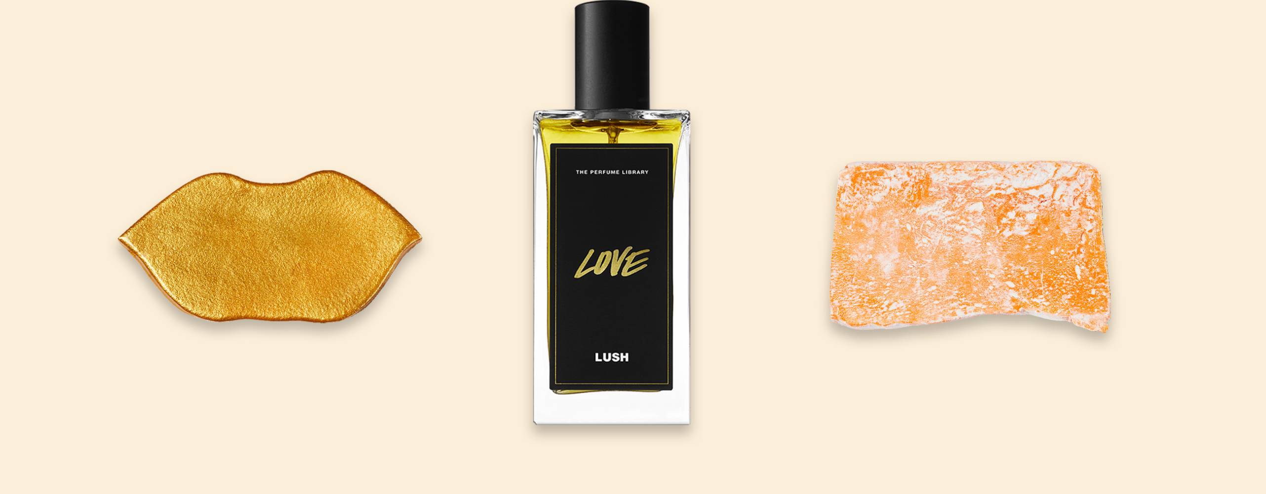 En läppmask i guld, en parfymflaska och en ljusorange tvål uppradade mot en ljusgul bakgrund