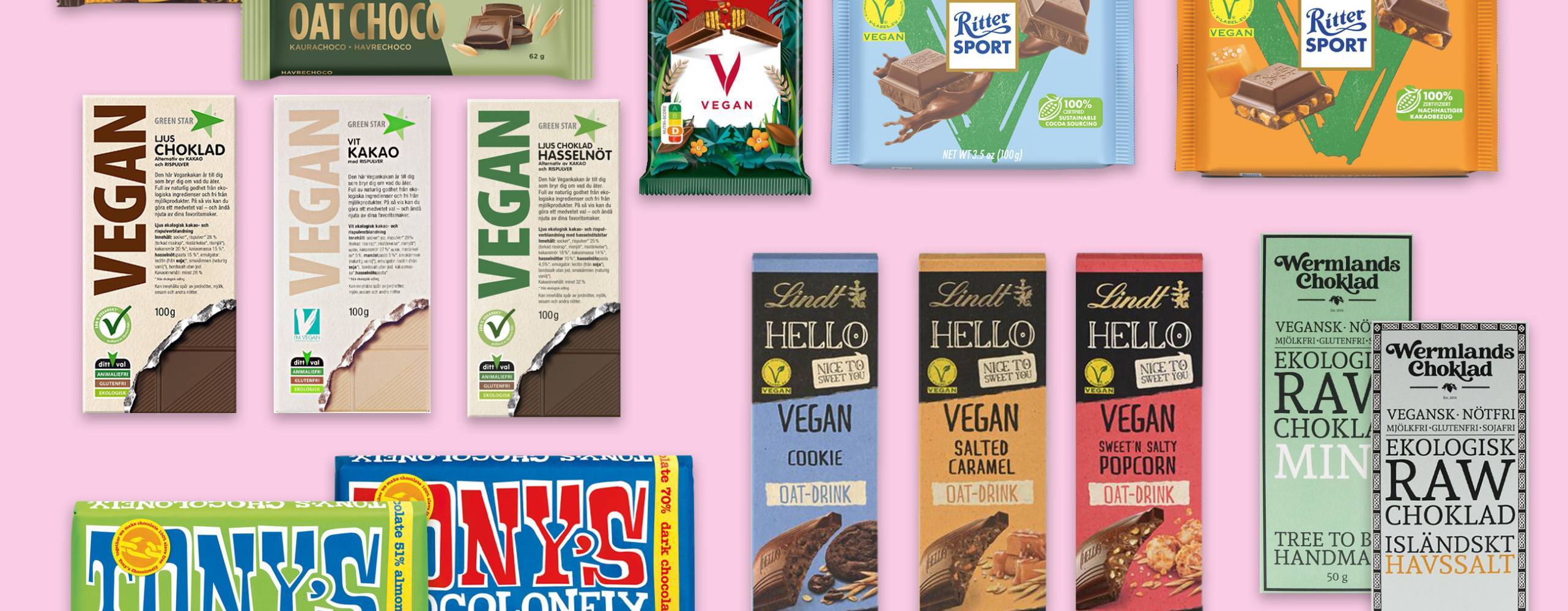 Massor av veganska chokladkakor uppstaplade mot en ljusrosa bakgrund