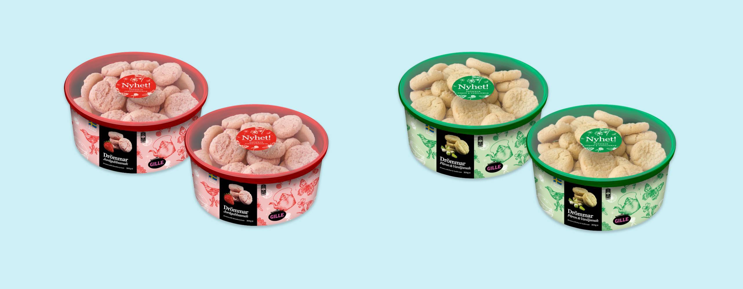 4 burkar med kakor placerade omlott mot en ljusblå bakgrund