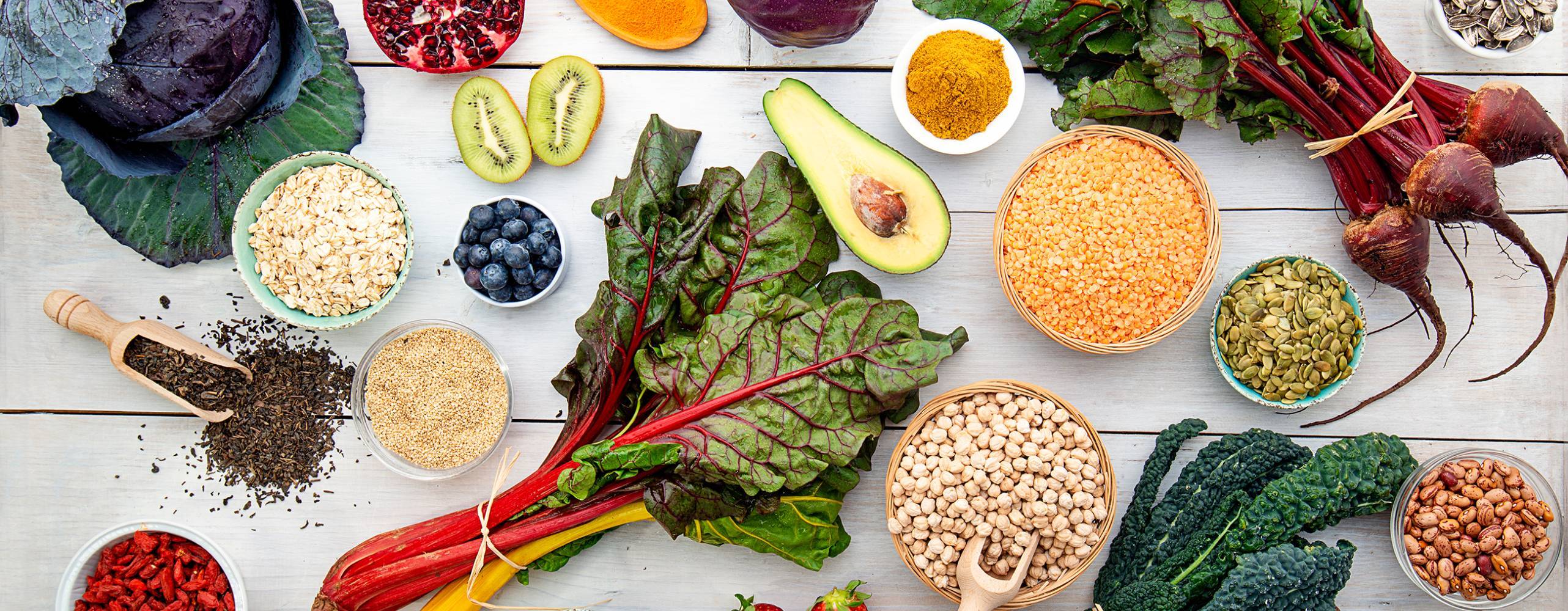 white wooden board with red vegetables cabbage turnips superfood