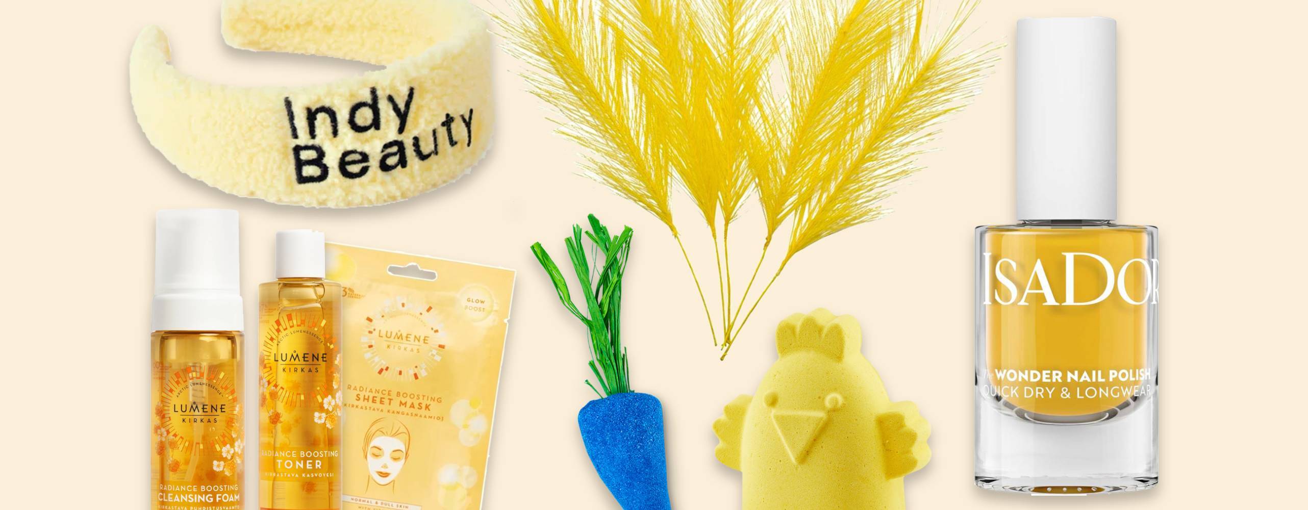 Gula skönhetsprodukter på en ljusgul bakgrund